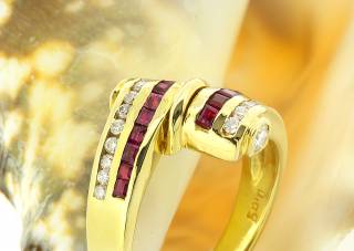 Ring with lines of diamonds and rubies