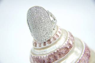 Ring with oval composition and diamonds