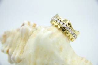 Ring with crown composition and diamonds