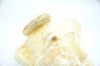 Ring with wide design and diamonds