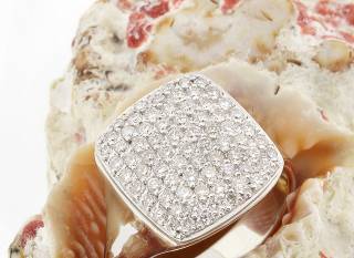 Ring with diamonds on square surface